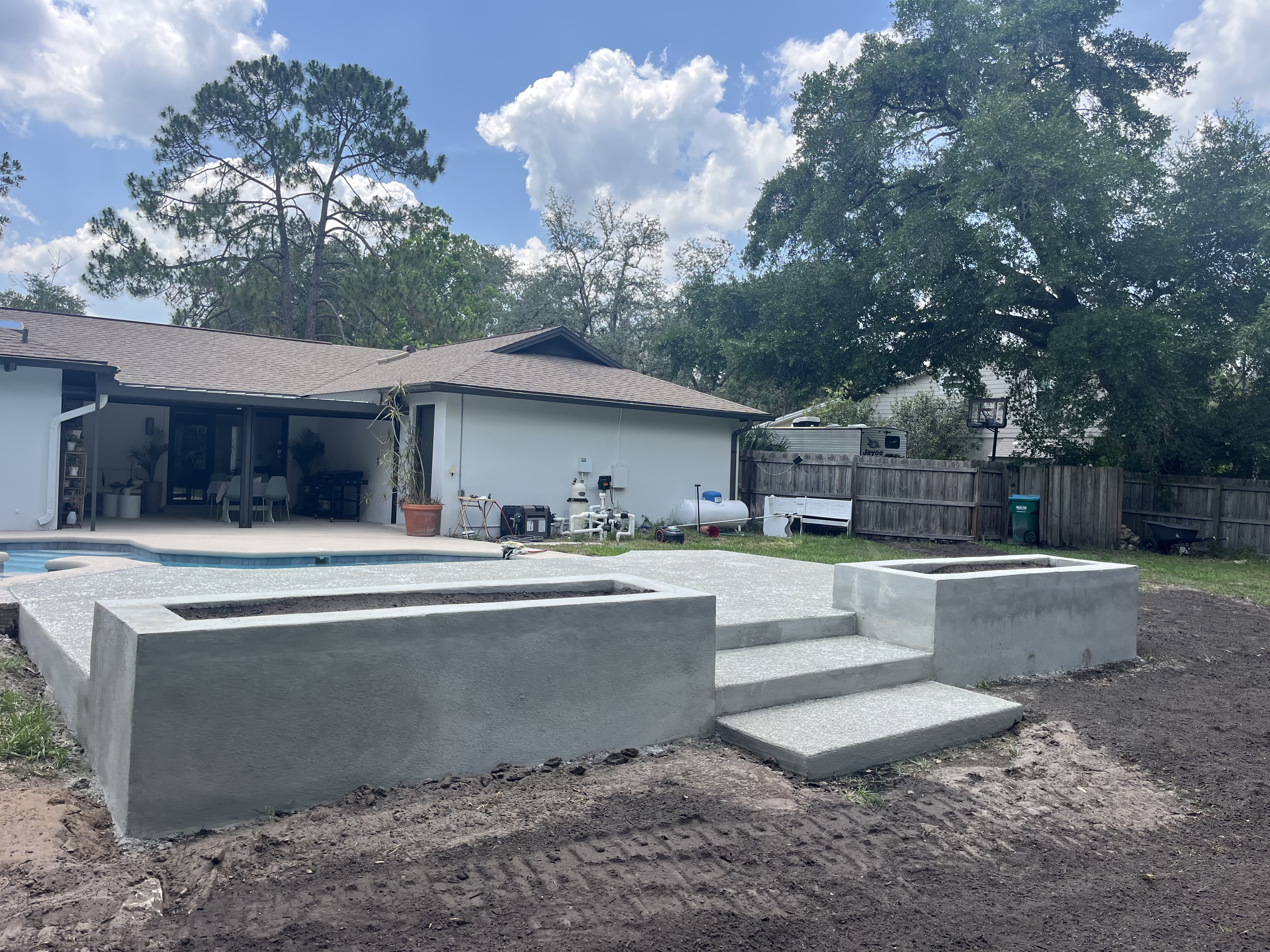Professional pool deck and garden bed construction by Austin Brown Construction